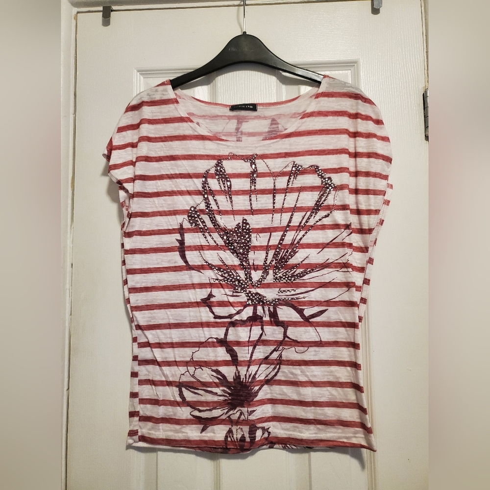 Flowy striped top with flower and rhinestone detailing